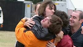 1996: Paul Arthurs hugs his Oasis bandmates at Hertfordshire show