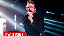 Olly Murs makes a splash narrowly avoiding his girlfriend Amelia floating in the pool at his Essex mansion