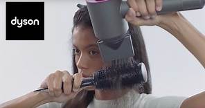 Styling your hair with the Dyson Supersonic™ hair dryer styling concentrator