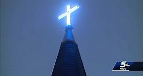 Cross at Oklahoma City cathedral illuminates night sky