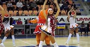Very beautiful young cheerleader dancing in short dress uniform