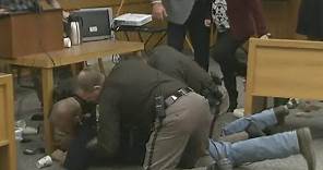 Father of victims lunges at Larry Nassar in court