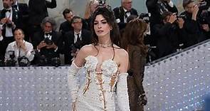Anne Hathaway in leggy display wearing Versace at 2023 Met Gala