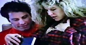 John Travolta gives his wife Kelly Preston her Christmas gift (1991)