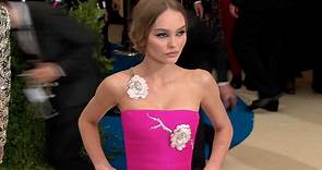 Lily Rose Depp arrives at the 2017 Met Gala in bright pink dress