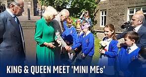 King and Queen meet a young Charles and Camilla on trip to Armagh, Northern Ireland