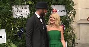 Happier Times: Kylie Minogue cuddles up to fiance Joshua Sasse