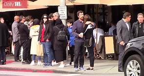Christian Bale embraces wife Sibi Blazic at street corner
