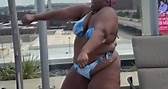 Singer Lizzo dances in a bikini on her hotel balcony
