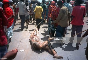 Image result for Dozens of Somalis dragged an American soldier through the streets of Mogadishu.