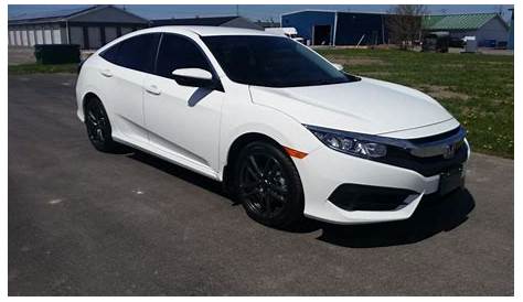 White 2016 Honda Civic with dark window tint and black rims | Honda