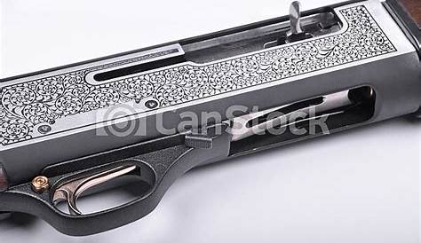 Shotgun trigger mechanism isolated on white background, hunting shotgun