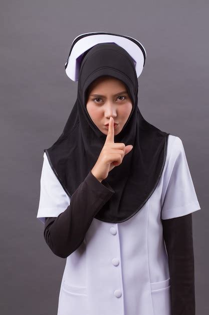 Premium Photo Muslim Nurse Hushing Asking For Silence
