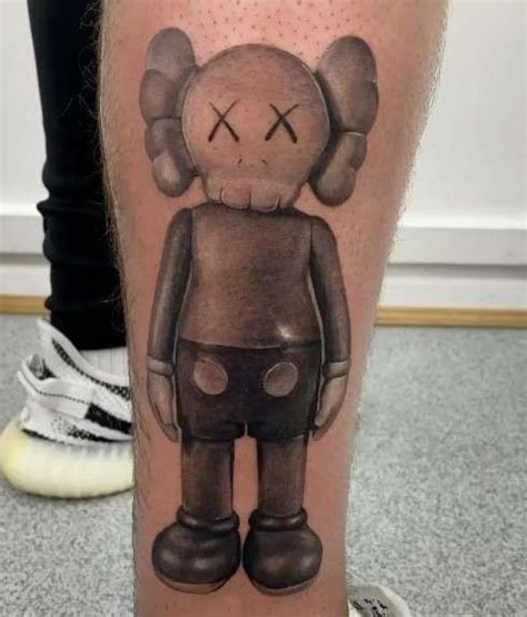 Kaws Tattoo Meaning Behind This Iconic Ink Inkcites