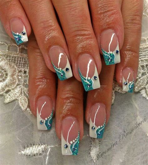 Choose a teal color with green hues and create a simple white design on your middle finger. Teal/white | Rhinestone nails, French nail designs, Nail ...