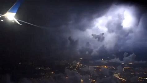Plane Takes Off In A Gigantic Storm With Lightning Illuminating The