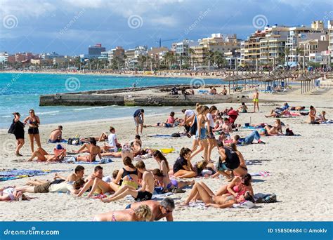 People Sunbathing On The Beach Of El Arenal Resort Town Majorca