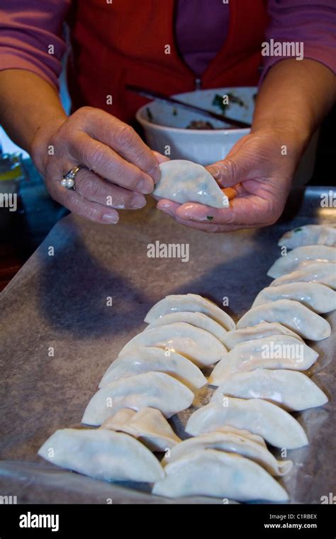 Chinese Cook Demonstrating How To Make Wor Tip Dumplings Also Known As