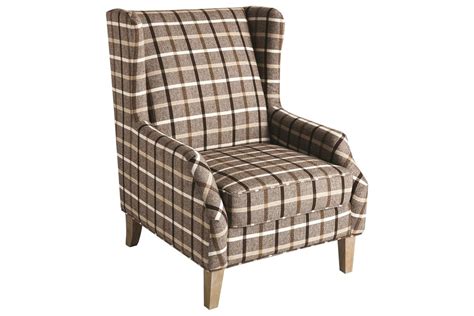 This chair features an arched back with this chair features an arched back with elongated wings to the sides which extend downward connecting. Scott Living Upholstered Wingback Chair with Plaid Design