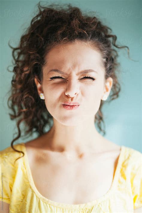 Charming Young Woman Making Funny Face By Stocksy Contributor