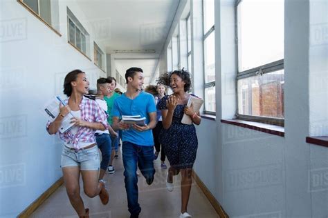 Students Running Down Hallway Laughing Stock Photo Dissolve