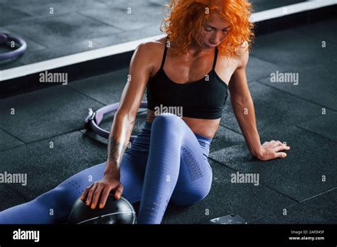 Sitting And Taking A Break Sporty Redhead Girl Have Fitness Day In Gym