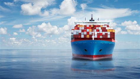 Front View From Bow Of A Large Blue Shipping Container Ship Stock Photo