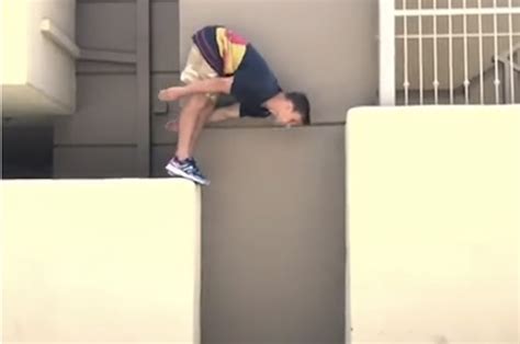 viral video guy leans into wall walks down it