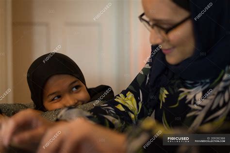 Muslim Mother And Daughter Smiling At Home — Indoors Joy Stock Photo