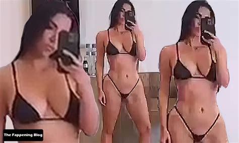 Top Kim Kardashian Shows Off Her Curves In A Micro Bikini Pics