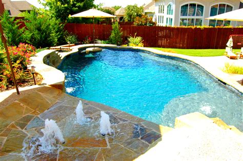 Another Stunning Example Of A Freeform Pool With Tequila Table And Splash Pad By Dallas Fort