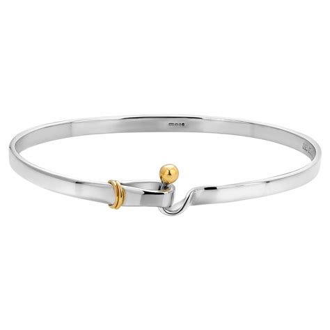 Tiffany And Co Eighteen Karat Yellow Gold And Silver Hook Bracelet At