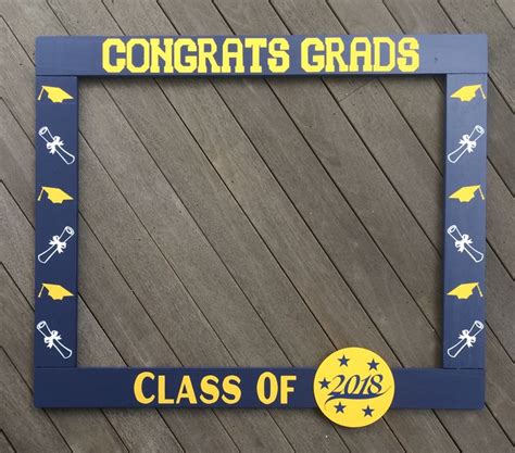 A Blue And Yellow Graduation Photo Frame With The Words Congrats Grads