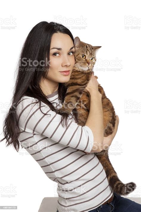 Beautiful Smiling Brunette Girl And Her Ginger Cat Stock Photo