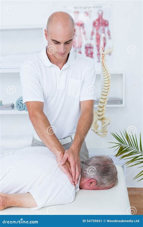 Physiotherapist Doing Neck Massage To His Patient Stock Image Image Of Healthcare