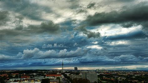 Photography Of The City Under Cloudy Skies · Free Stock Photo