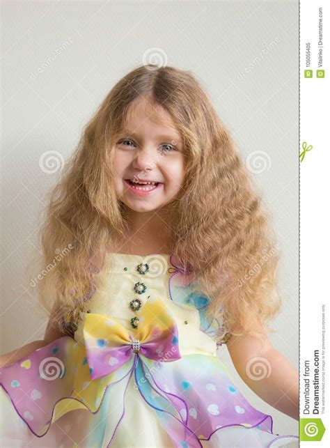 Beautiful Smiling Little Girl With Long Blond Curly Hair