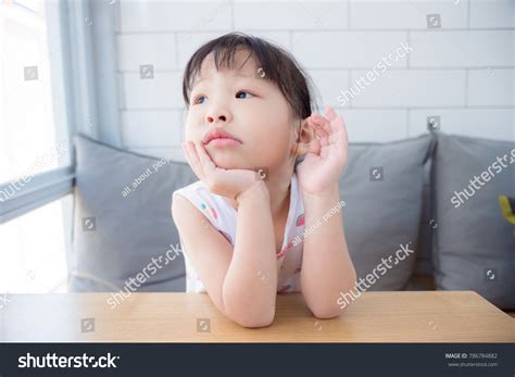 Little Asian Girl Sitting Alone Thinking Stock Photo 786784882