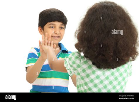 Two Indian Children Playing A Clapping Game Stock Photo Alamy