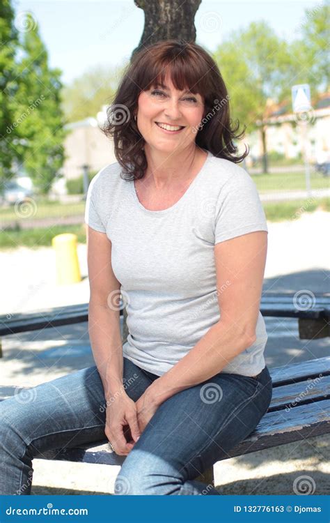 Beautiful Happy Mature Caucasian Woman Outside In The Park Stock Image
