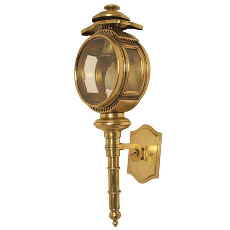 The robust frame features an oversized handle and rivet details, all finished in a modern earth black. Brass Carriage Lamp/Lantern/Sconce | 1stdibs.com | Carriage lamps, Sconces, Lamp