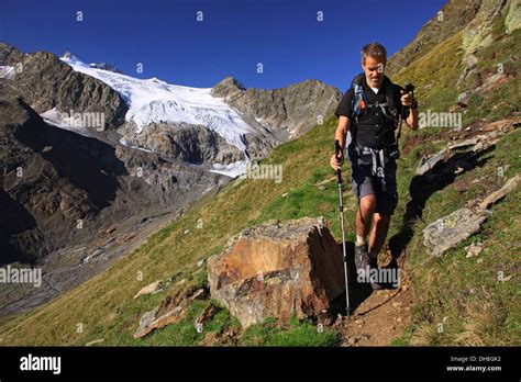 Mountain Walker Walking With Walking Poles In The Mountains Of The