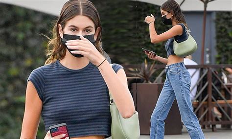 Kaia Gerber Flashes Her Toned Midriff In A Grey Striped Crop Top And