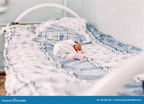Newborn Baby Lying Alone On Bed In Hospital Stock Photo Image Of