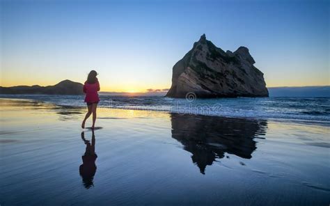 Young Woman Enjoys Wharariki Beach In New Zealand Stock Image Image
