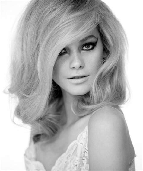 This 60s hairstyle matches the mischief on the woman's face. 60s hairstyles for long hair