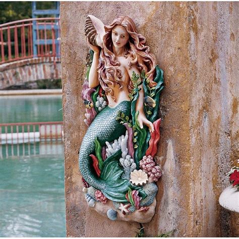 I placed the mermaid on the western side of my pool so that it has a sunset background with the coming of evening. Melody Cove Mermaid Wall Sculpture NG33502 - Design Toscano | Mermaid sculpture, Mermaid wall ...
