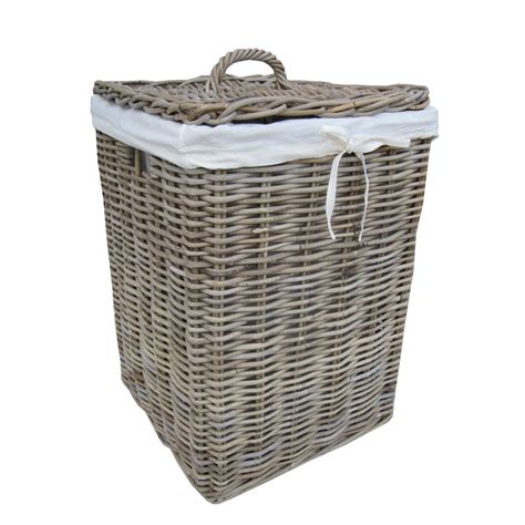 Large rattan floor baskets are the ideal home for extra blankets and throw pillows. Grey & Buff Square Rattan Laundry Basket