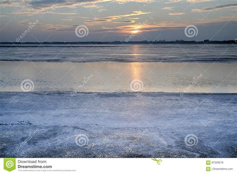 The Sun Set Over The Frozen Lake Stock Photo Image Of Shape Light