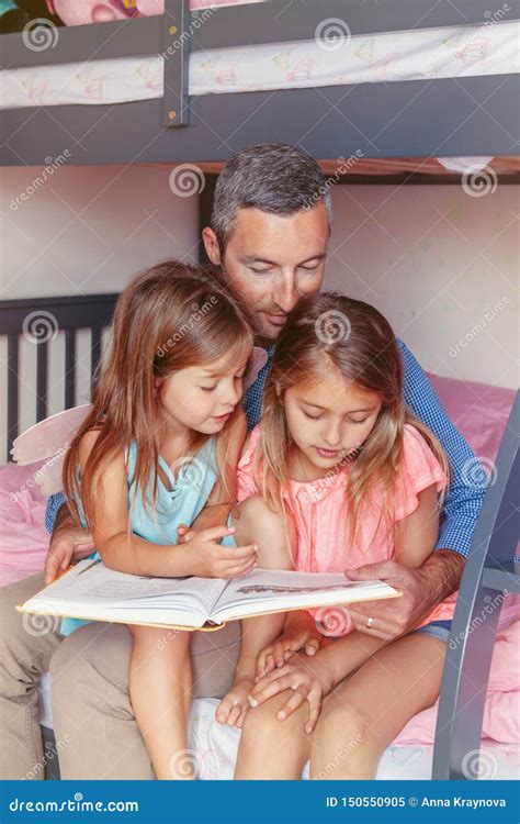 Father And Daughters Girls At Home Reading Book Stock Image Image Of Lifestyle Girl 150550905